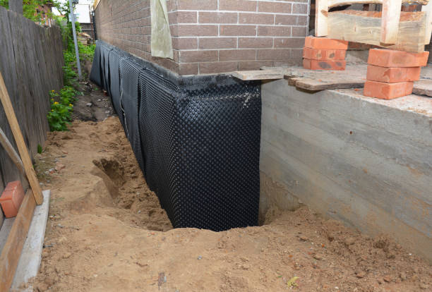 SJ Waterproofing Pros technician performing targeted Waterproofing assessment in Upperco, MD